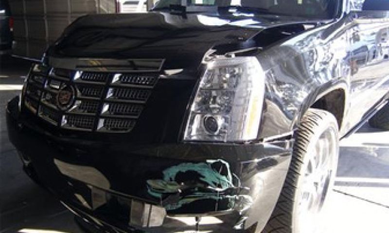 Escalade met lichte parkeerschade te koop