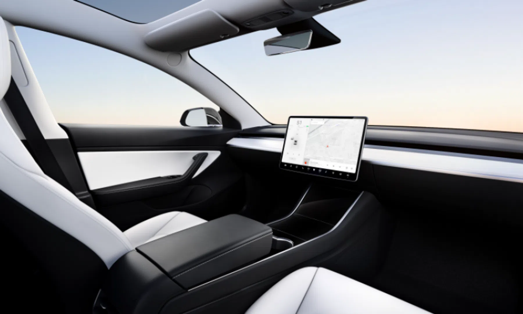 tesla zelfrijdende taxi zonder stuur pedalen elon musk
